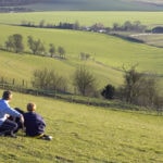 Two boys looking at the view across a valley