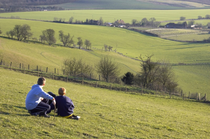 Two boys looking at the view across a valley